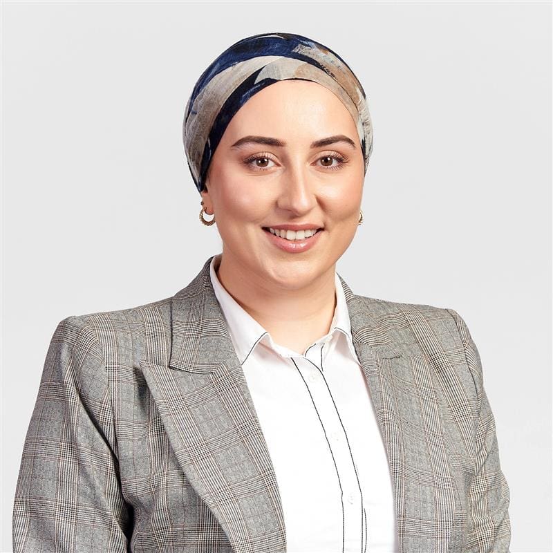 Nilufer wearing a grey jacket, profile photo